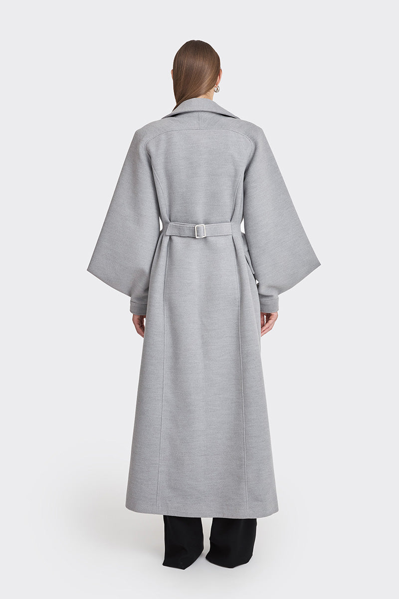 Gray coat from the MS. DOLL collection by Stolen Stores, displayed on a model with stylish details and a modern fit.