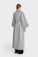 Gray coat from the MS. DOLL collection by Stolen Stores, displayed on a mannequin with stylish detailing.