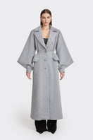 Gray coat from Stolen Stores' Ms. Doll collection, displayed on a mannequin, showcasing stylish, fall-ready outerwear.