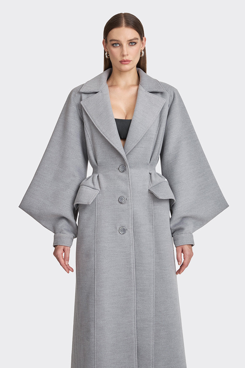 Gray coat from the MS. DOLL collection by Stolen Stores, displayed on a mannequin with stylish details.
