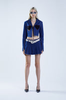 Stolen Stores Ms. Heart blue cut-out denim suit jacket with mini skirt, featuring stylish design details and a fitted silhouette.