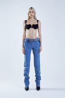 Blue denim MS. HEART pants by Stolen Stores, featuring a casual fit and stylish design, worn by a model.