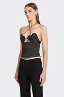 Black side bustier top from Stolen Stores featuring a fitted design and stylish cut, shown on a model.