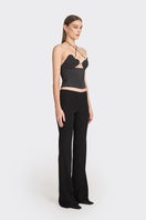 Black MS. Heart side bustier top from Stolen Stores, featuring a fitted design with side details, shown on a model.