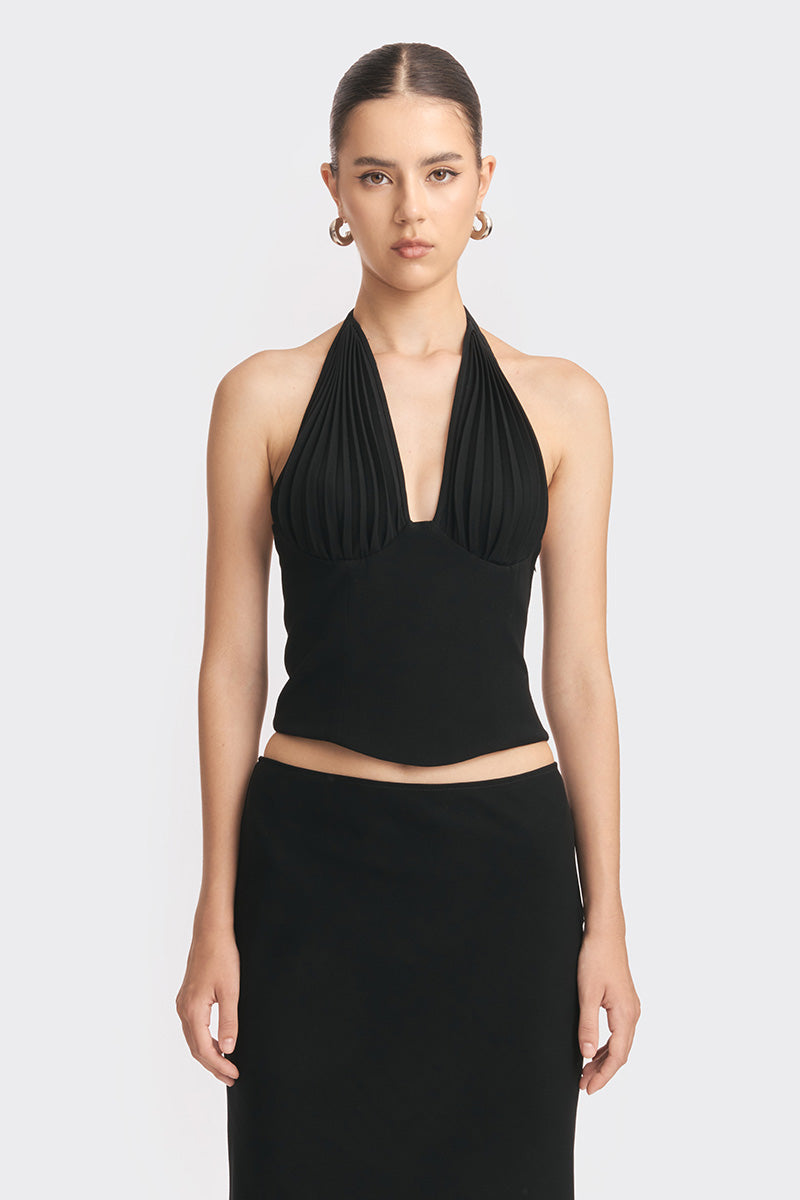 Black MS. Pleat corset top by Stolen Stores, featuring structured pleats and a fitted design, shown on a model.