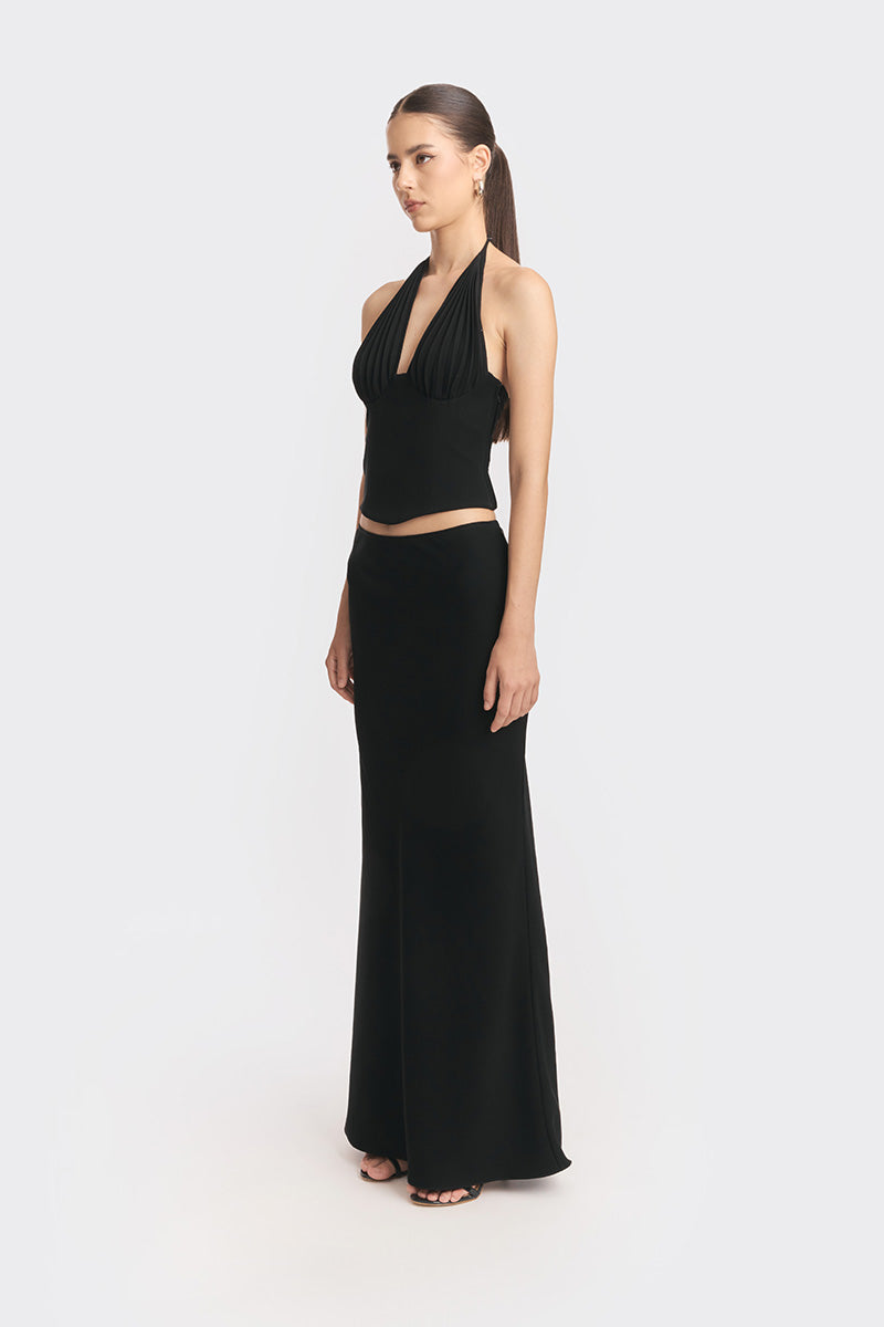 Black MS. Pleat corset top by Stolen Stores, featuring structured pleats and fitted design, worn by a model in the image.