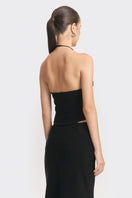 Black MS. Pleat corset top by Stolen Stores featuring pleated design and structured fit, shown on a model.