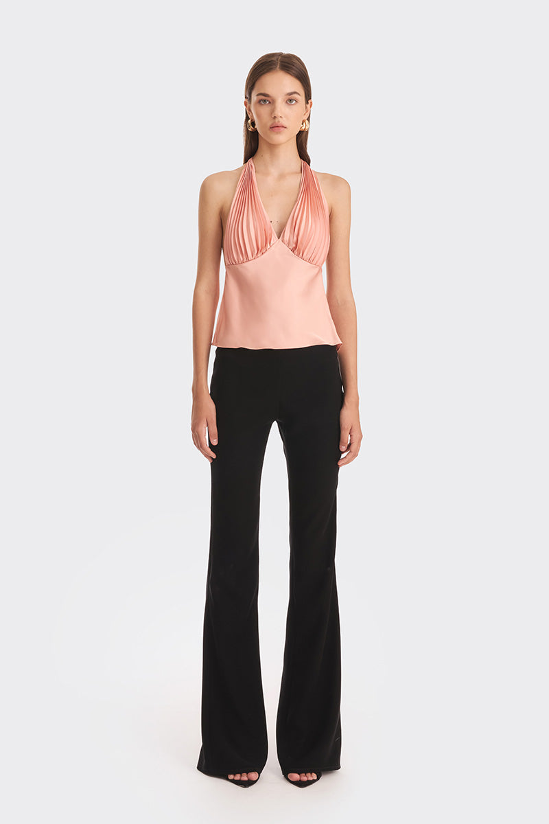 Stolen Stores Ms. Pleat Peach Top featuring a pleated design and vibrant papaya color, displayed on a mannequin.