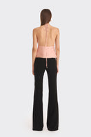 Stolen Stores Ms. Pleat Peach Top featuring soft pleats and a relaxed fit, shown in a vibrant papaya color.
