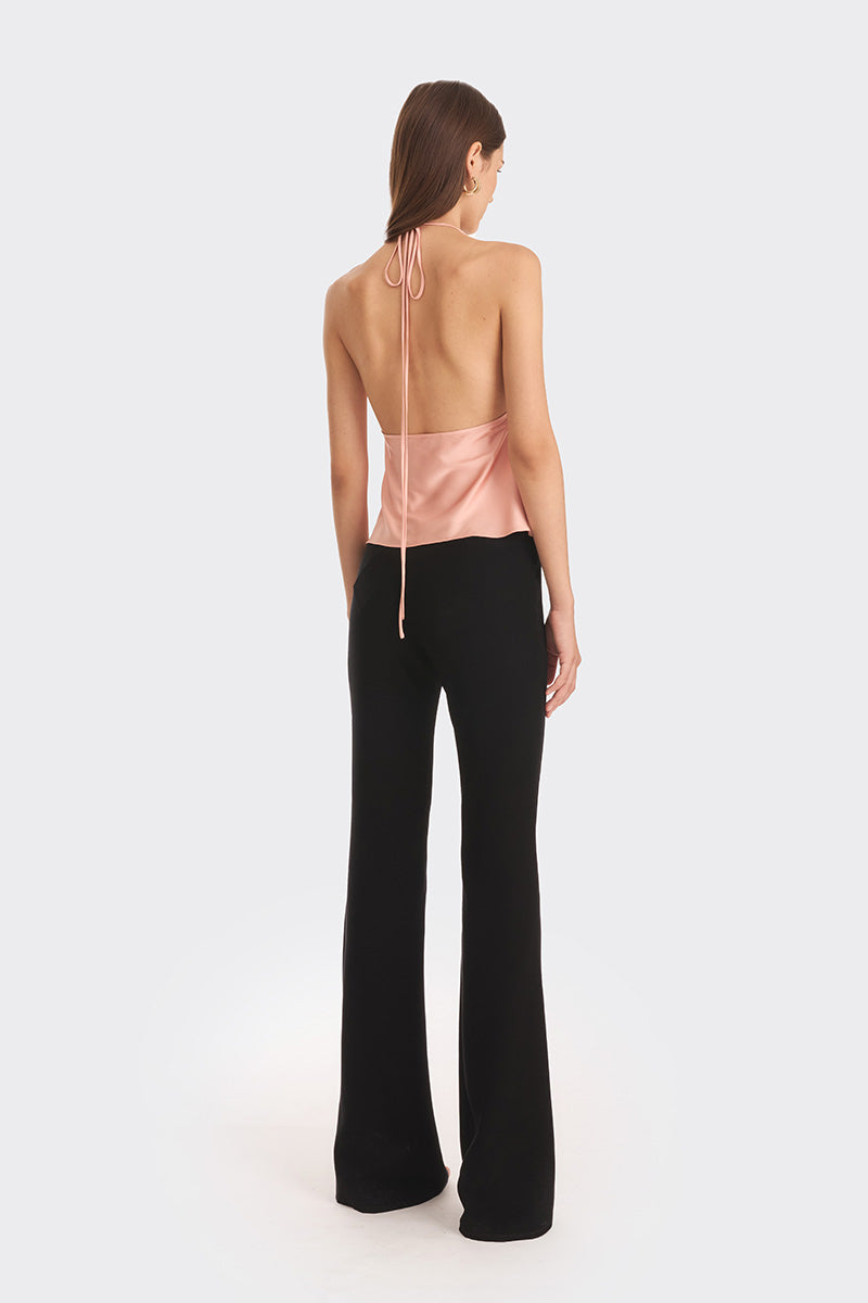 Stolen Stores Ms. Pleat Peach Top featuring a pleated design and soft papaya color, styled with a relaxed fit.