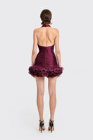Dark purple CULT MIA X Stolen Stores Ms. Tutu halter mini dress displayed on a mannequin. Stylish and fitted design.