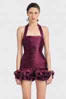 Dark purple Cult Mia X Stolen Stores Ms. Tutu halter mini dress displayed on a model, showcasing stylish and vibrant design.