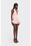 Stolen Stores Ms. Tutu V-neck mini dress in peach, styled on a model, showcasing its soft fabric and flattering fit.