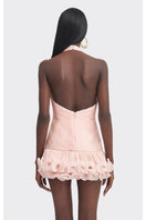 Stolen Stores peach V-neck mini dress featuring a fitted silhouette, styled with a playful and feminine look.