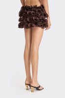 Brown spiral mini skirt from Stolen Stores featuring a fitted waistband and playful spiral pattern.