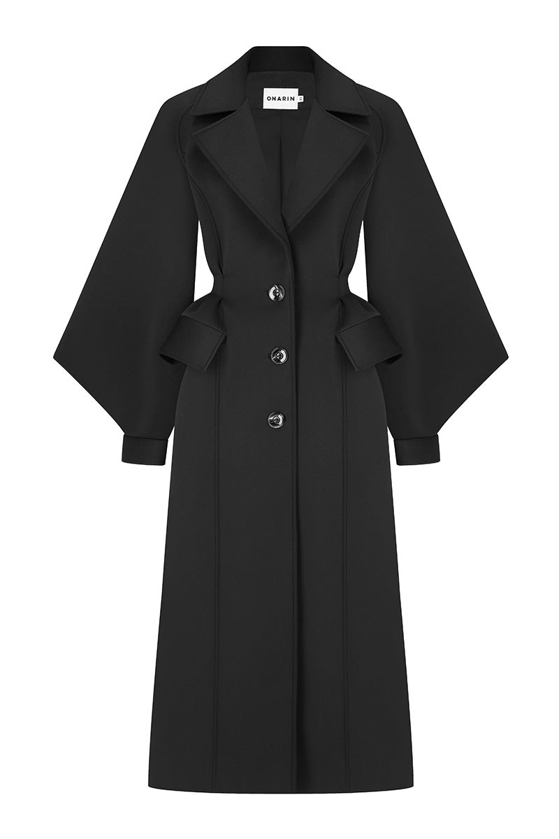 Black coat from the MS. DOLL collection by Stolen Stores, featuring a stylish design perfect for cold weather.