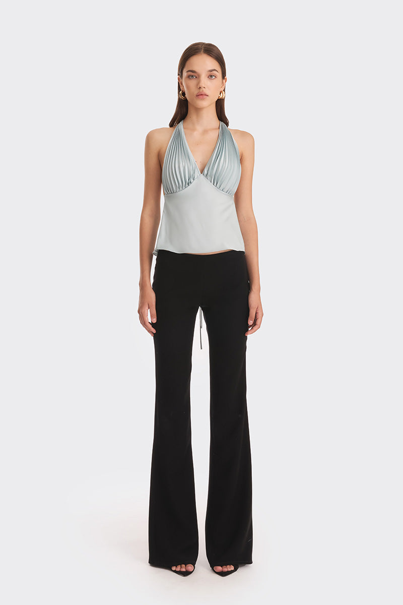 Dusty blue pleated top from Stolen Stores featuring a stylish, flowy design perfect for casual or dressy occasions.