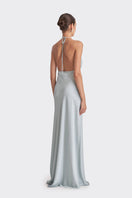 Dusty blue Stolen Stores MS. Pleat maxi dress with flowing pleats and elegant design, displayed on a hanger.