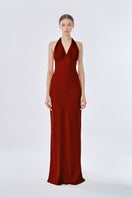 Stolen Stores MS. Pleat Gown in Rose Apple, a flowing maxi dress with pleated design and soft pink color, displayed on a hanger.