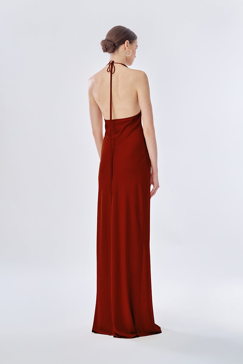 Elegant rose apple pleated gown by Stolen Stores, featuring a flowing maxi dress design with intricate pleats.