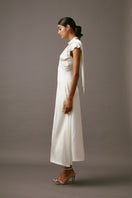 Elegant MUMTAAZ embellished maxi dress in pearl by MASTANI, featuring intricate beadwork and flowing fabric.