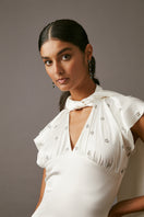 Elegant MUMTAAZ embellished pearl maxi dress by MASTANI featuring intricate embroidery and flowing fabric.