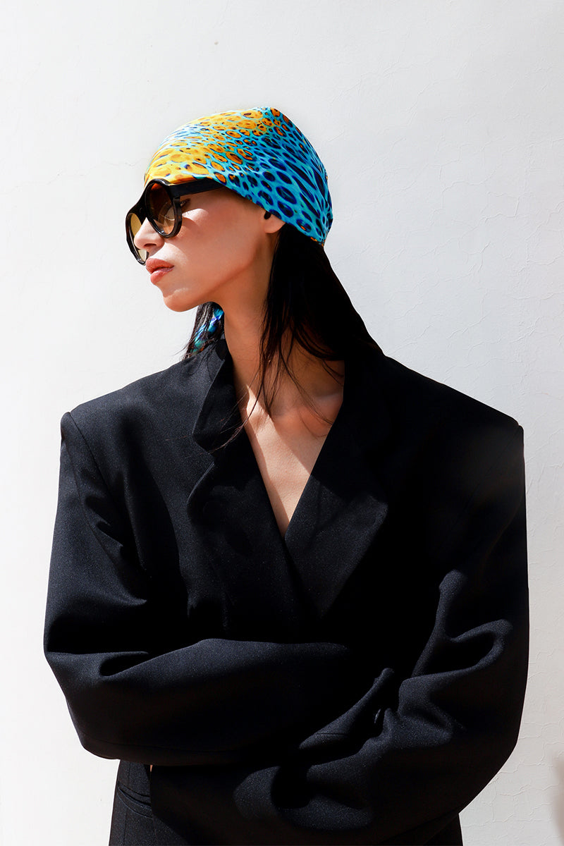 Silk MUNIR MOUSSARD scarf by Amel Batita featuring a 90-inch bandana style with intricate patterns and vibrant colors.