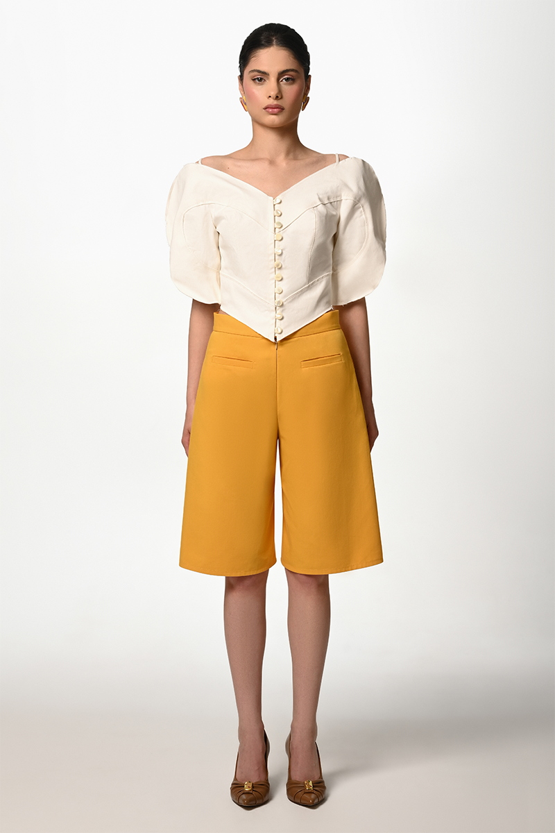 Liya mustard Bermuda shorts with a relaxed fit, front pockets, and a casual style perfect for summer wear.