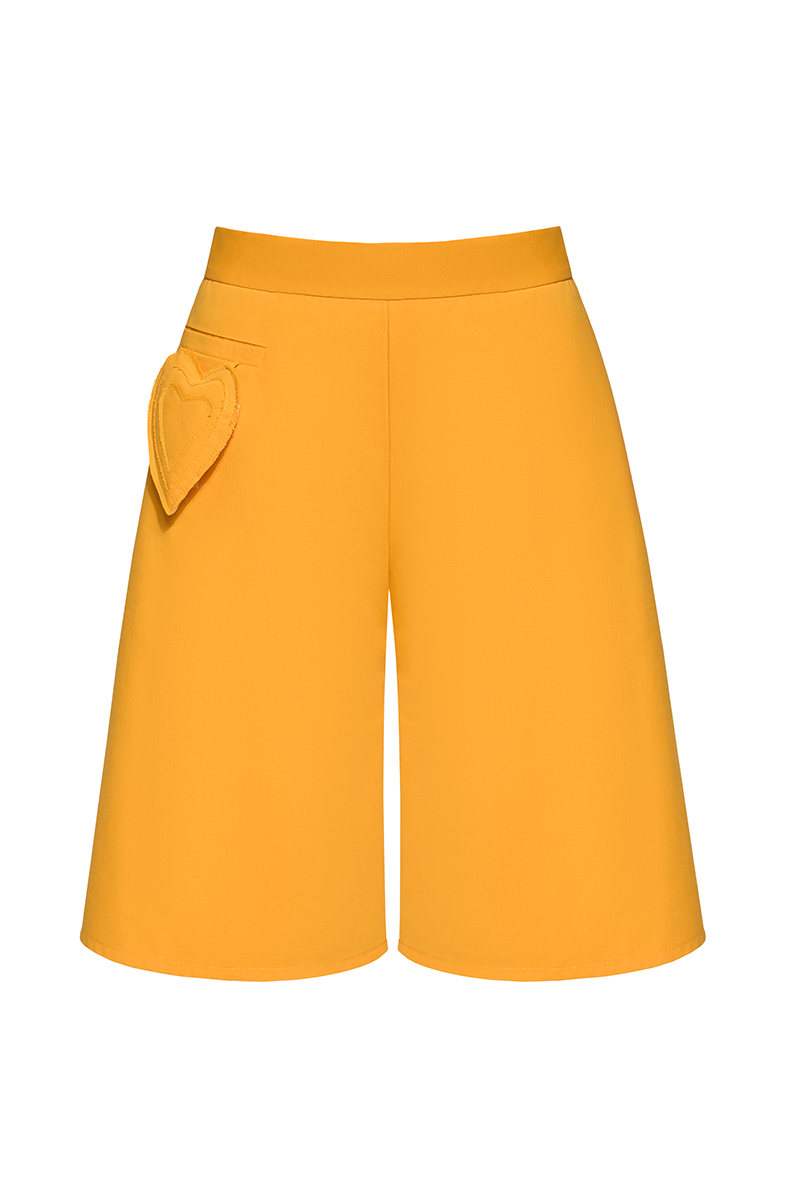 Liya mustard Bermuda shorts in yellow with a casual fit, featuring a relaxed waistband and knee-length design.