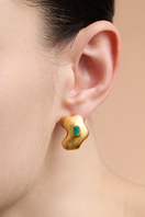 Gold earrings from MUZO STUDIOS by Fenomena, featuring a stylish and elegant design.