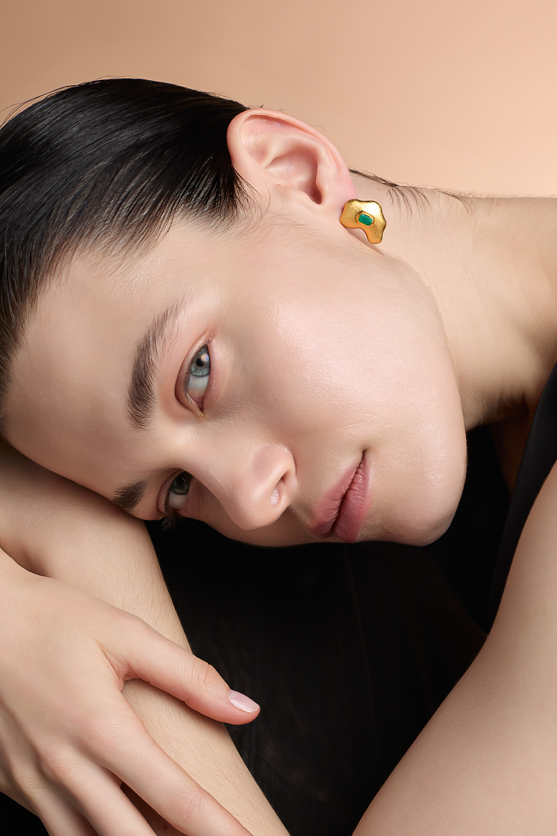 Gold Muzo Studios earrings by Fenomena, featuring elegant hoop design with polished finish.