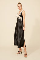 Black silk nightgown with satin trim from Bocan Couture, featuring a flowing design and elegant detailing.