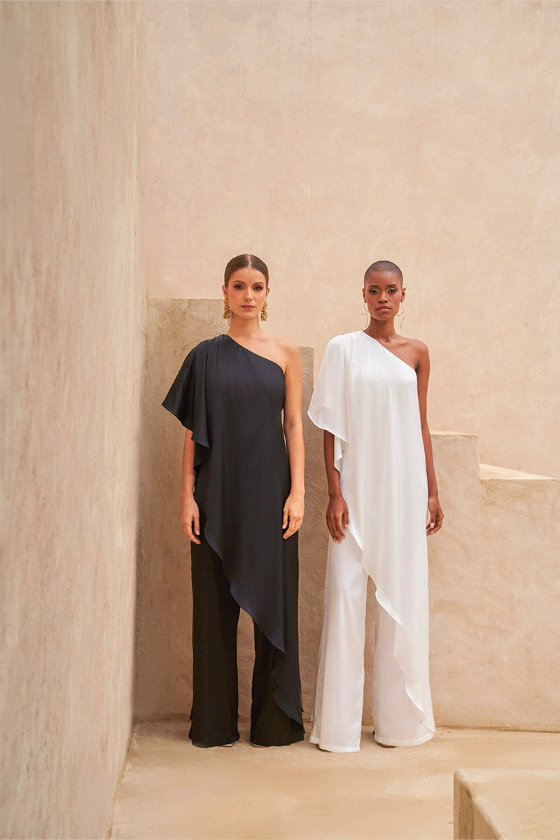 Black Nahir jumpsuit by Tinta Latina, stylish one-piece outfit with sleek design and fitted silhouette.