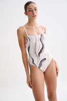 Nelblu Tierra One-Piece Swimsuit with colorful tropical print, featuring a flattering cut and adjustable straps.