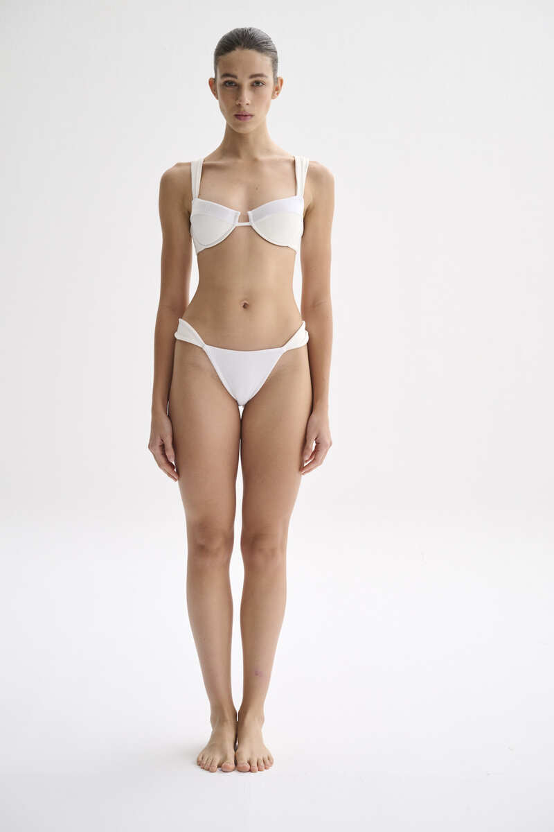 Nelblu Shell bikini top in white, featuring a sleek design with shell accents, perfect for beach and poolside wear.