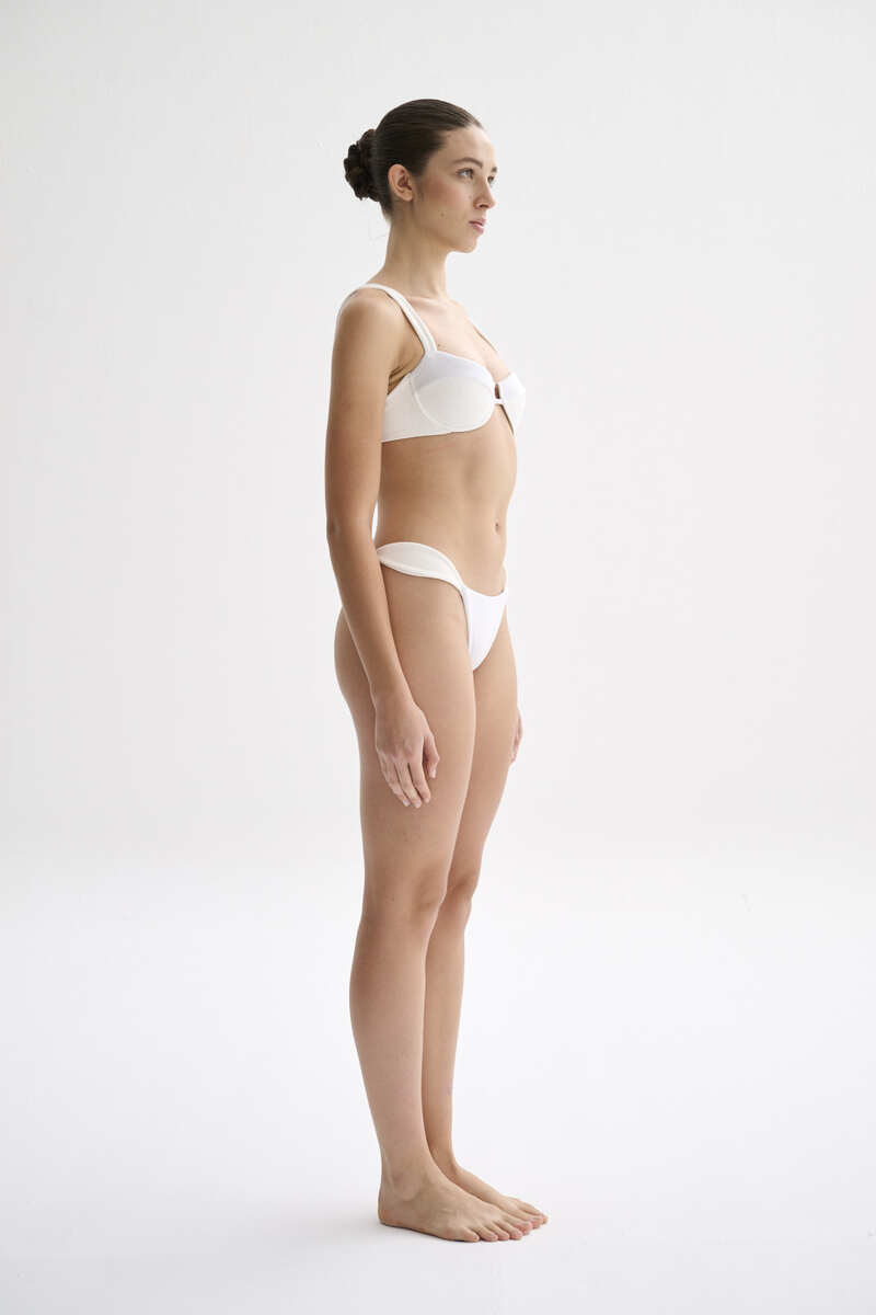 Nelblu shell bikini bottom with vibrant pattern, showcasing a stylish and comfortable swimwear design for beach or pool.