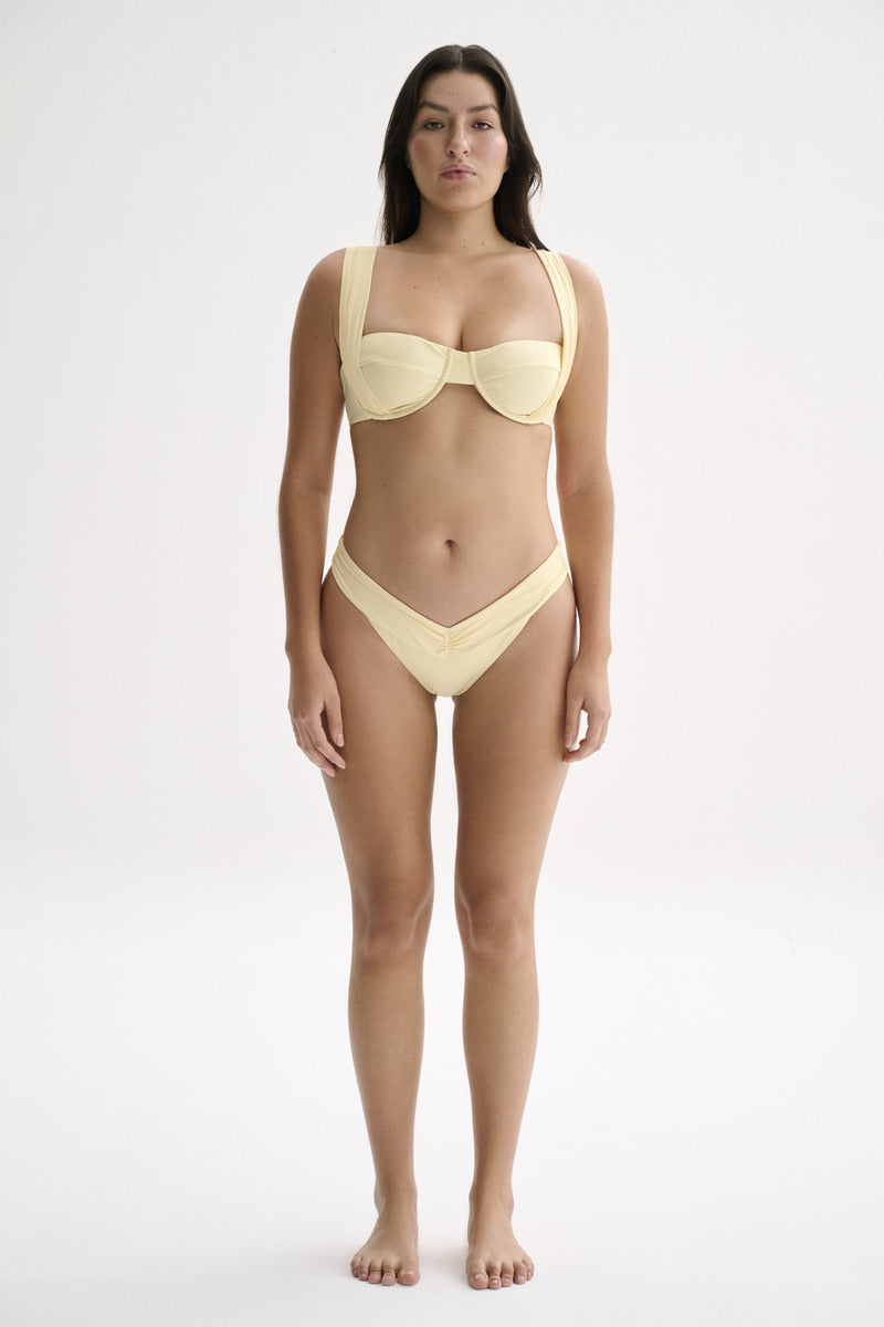 Nelblu Marea top bikini in blonde, featuring a stylish bikini top with adjustable straps and vibrant swimwear design.