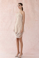 Neutral pleated tulle dress by HACCHIC COUTURE, featuring a mini length, soft fabric, and elegant design, shown on a model.
