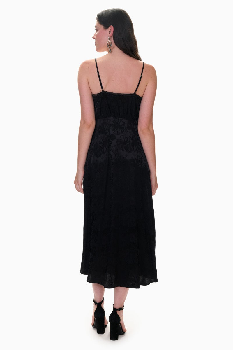 Black Rebecca Taylor Neveah Jacquard Cami Midi Dress hanging on a hanger with intricate jacquard fabric pattern.
