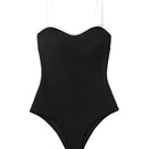 Black ribbed swimsuit by Seaquelle featuring a sleek design and fitted silhouette, perfect for beach and poolside wear.
