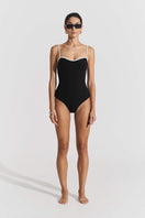 Black ribbed swimsuit by Seaquelle featuring a sleek design, close-up of the textured fabric and classic fit.