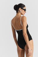 Black ribbed Seaquelle swimsuit, showcasing a stylish one-piece with textured fabric and sleek design.