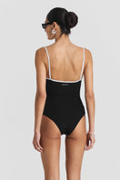 Black ribbed swimsuit by Seaquelle featuring a sleek, fitted design perfect for swimming and beachwear.