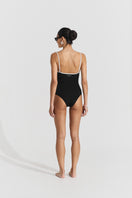 Black ribbed swimsuit by Seaquelle, featuring a fitted design and sleeveless style, perfect for beach or pool days.