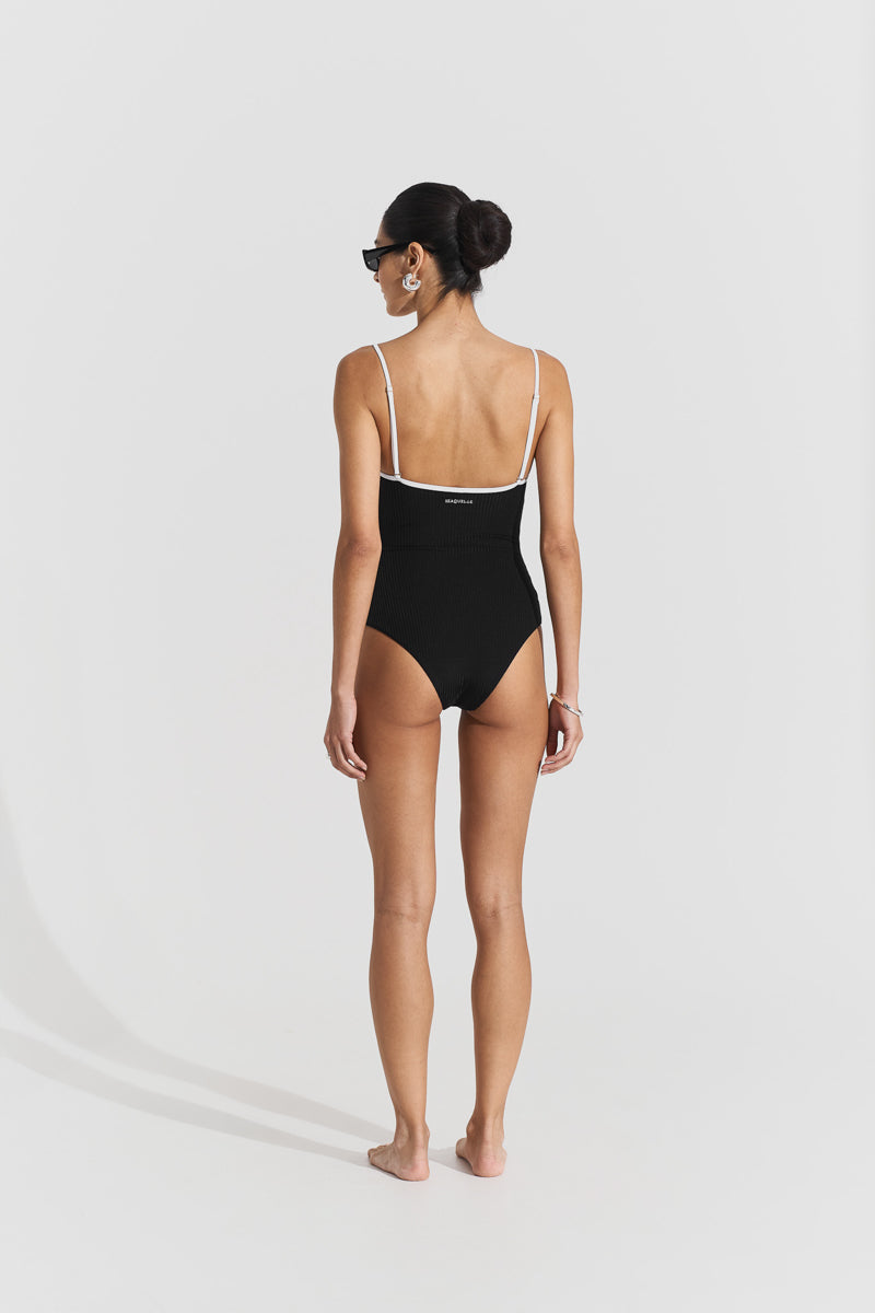 Black ribbed swimsuit by Seaquelle, featuring a fitted design and sleeveless style, perfect for beach or pool days.