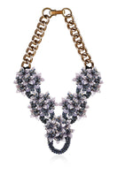 Gray Greta necklace by Aidan & Ice featuring a stylish chain and pendant, displayed on a neutral background.