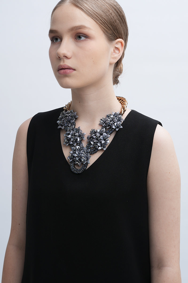 Aidan & Ice Gray Greta necklace featuring a sleek gray pendant on a delicate chain, styled for elegant accessorizing.