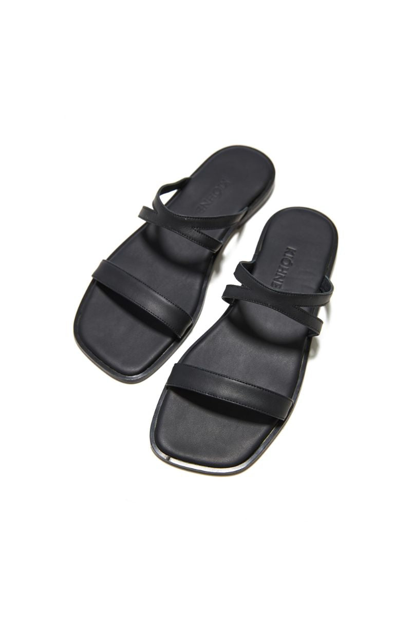 Black KIÓHNE Noah sandals featuring open-toe design and adjustable straps, perfect for casual summer wear.