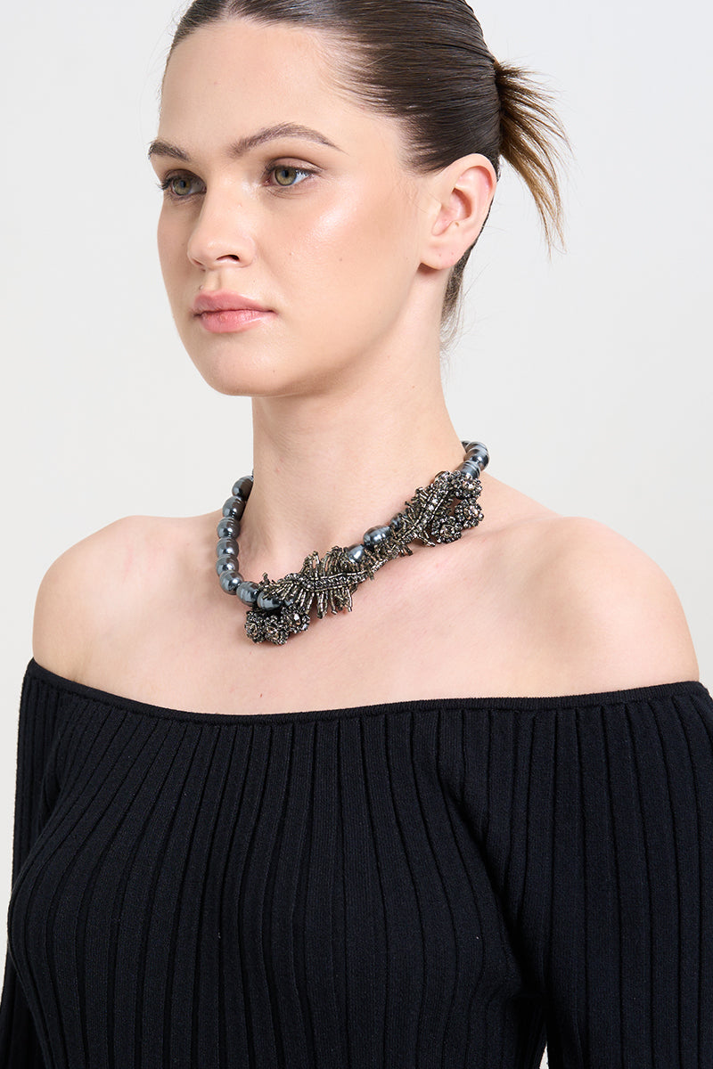Aidan & Ice Ocean Dream necklace featuring a delicate chain and ocean-inspired pendant, worn as a stylish accessory.