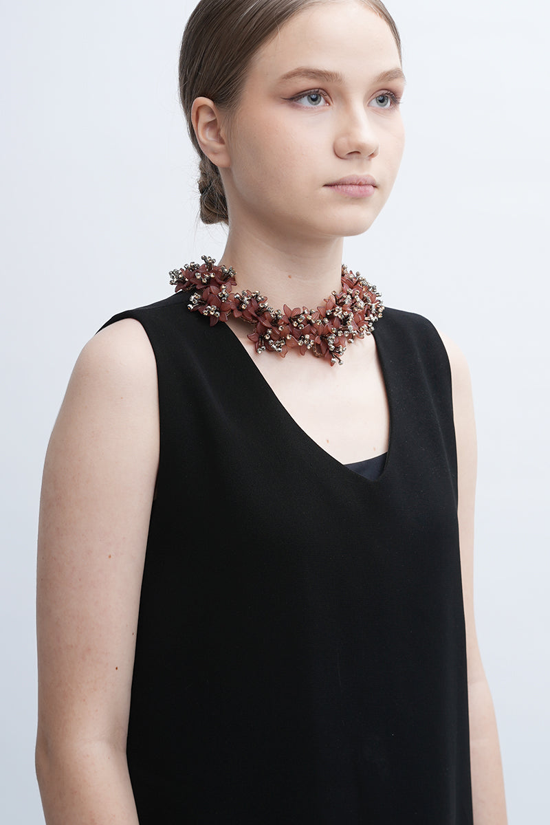 Aidan & Ice Peach Emilia Necklace featuring a delicate peach pendant on a fine chain, styled for a feminine look.